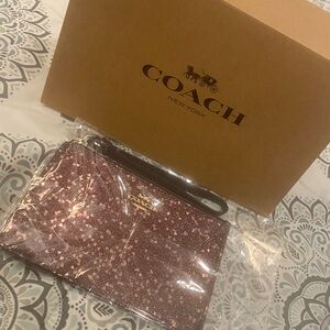 Coach Pink Glitter Wristlet with Black Strap
